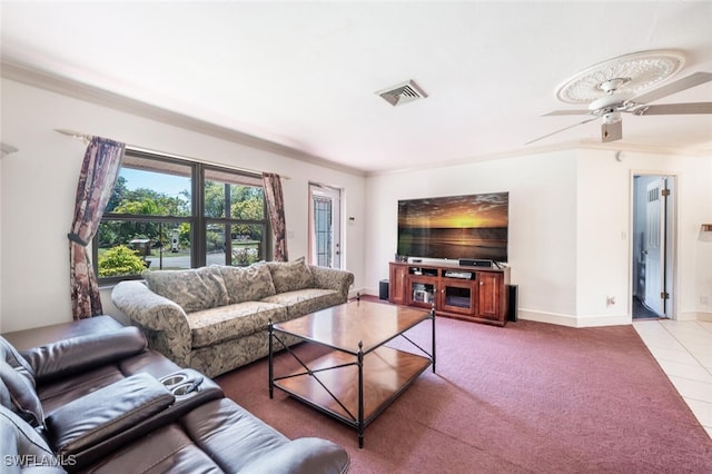 living area featuring visible vents, carpet, crown molding, tile patterned flooring, and baseboards