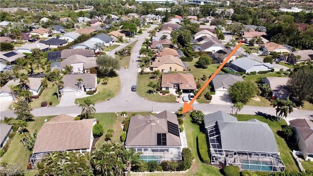 birds eye view of property with a residential view