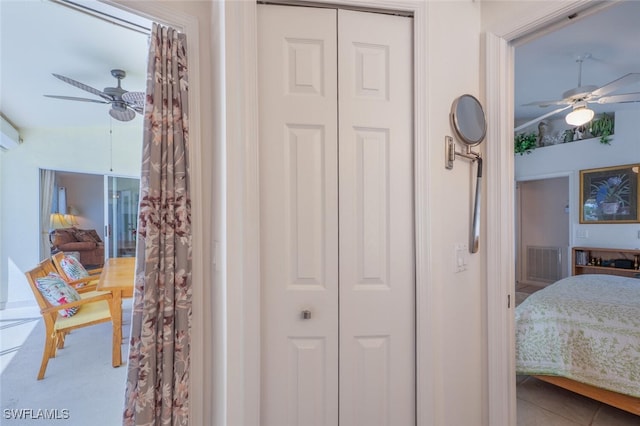 tiled bedroom featuring a closet and visible vents