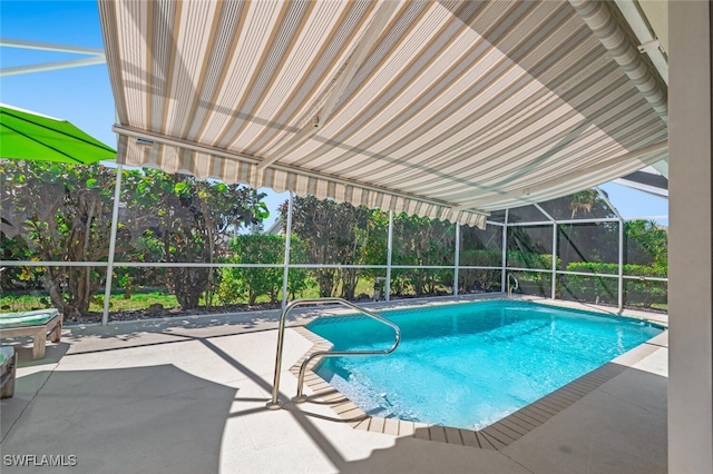 outdoor pool with a patio area and a lanai