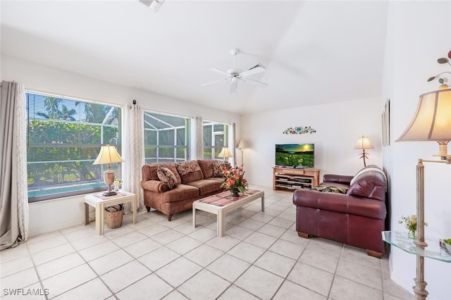 living area with light tile patterned floors, visible vents, and ceiling fan