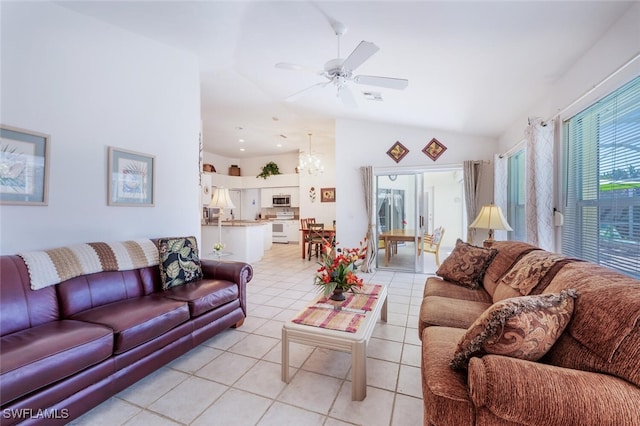 living room featuring light tile patterned floors, visible vents, ceiling fan with notable chandelier, and lofted ceiling