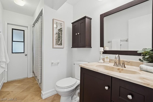 full bath featuring toilet and vanity