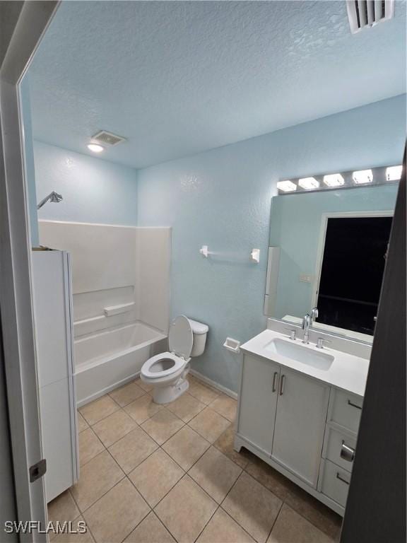 bathroom with tile patterned flooring, visible vents, a textured ceiling, and vanity