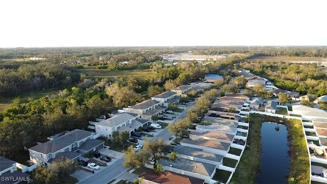 bird's eye view with a water view and a residential view