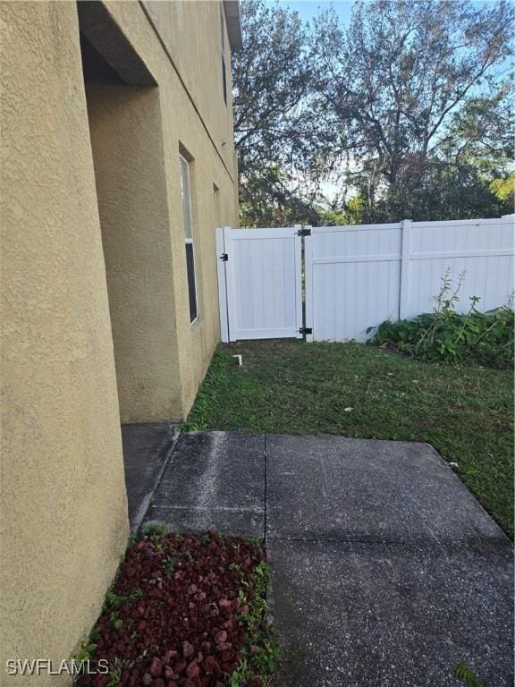 view of yard featuring a gate and fence