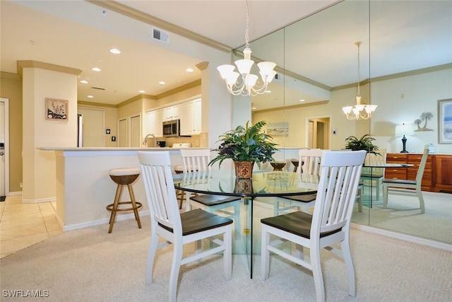 dining space featuring a notable chandelier, recessed lighting, light colored carpet, visible vents, and ornamental molding