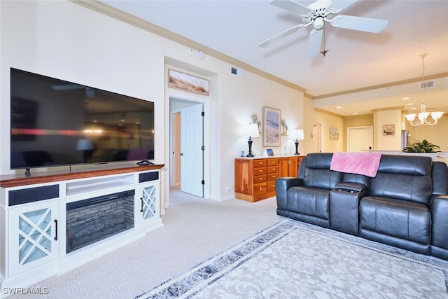 living room with light carpet, visible vents, baseboards, ornamental molding, and ceiling fan with notable chandelier