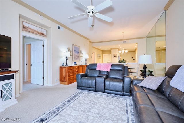 living room with visible vents, ornamental molding, light carpet, baseboards, and ceiling fan with notable chandelier