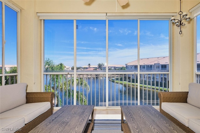 unfurnished sunroom with a water view