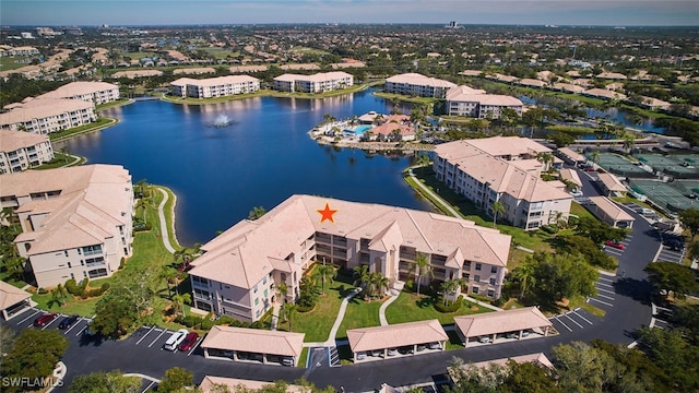 bird's eye view with a water view and a residential view