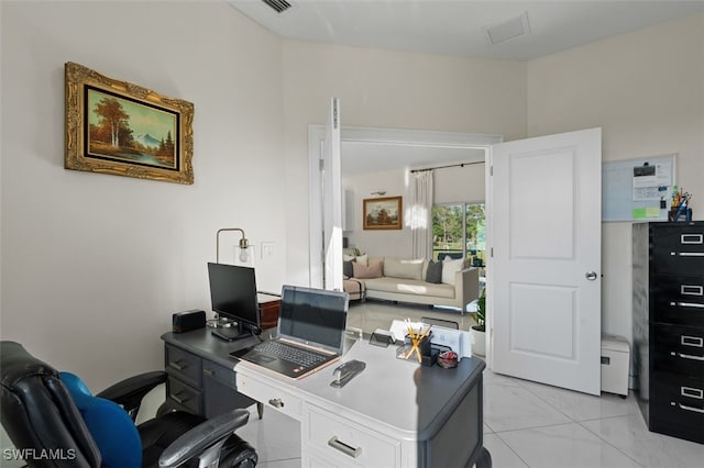 office space featuring marble finish floor