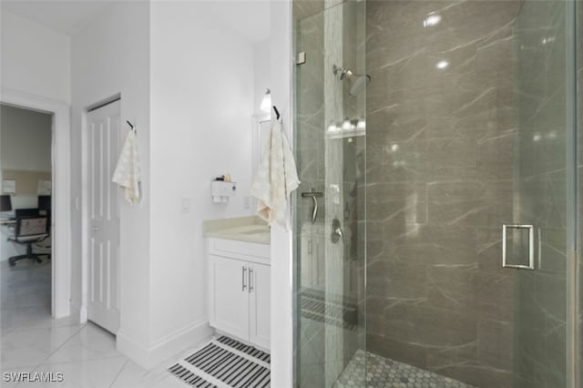 bathroom with a marble finish shower, baseboards, marble finish floor, and vanity