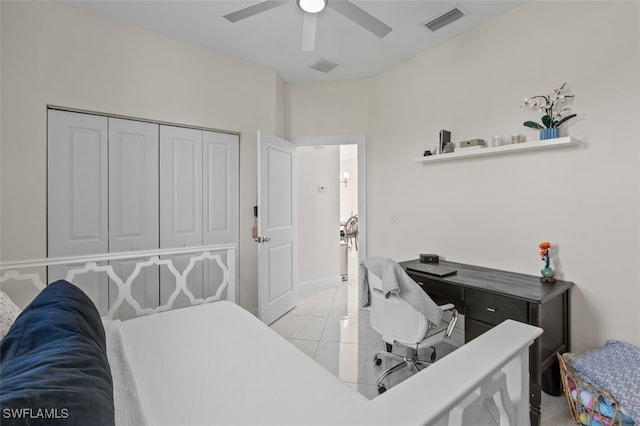 office featuring light tile patterned floors, a ceiling fan, and visible vents