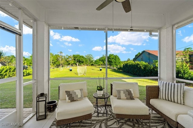 sunroom / solarium with a ceiling fan