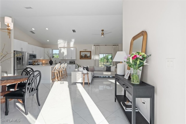 interior space with high vaulted ceiling, recessed lighting, visible vents, and ceiling fan