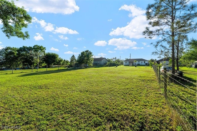 view of yard with fence