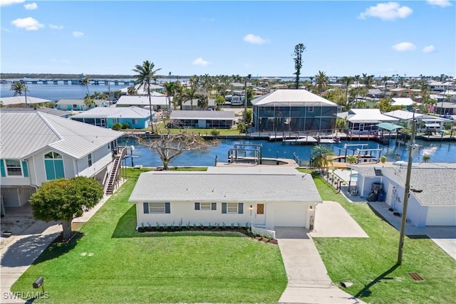 bird's eye view with a residential view and a water view