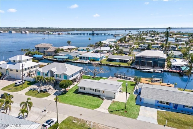 aerial view with a residential view and a water view