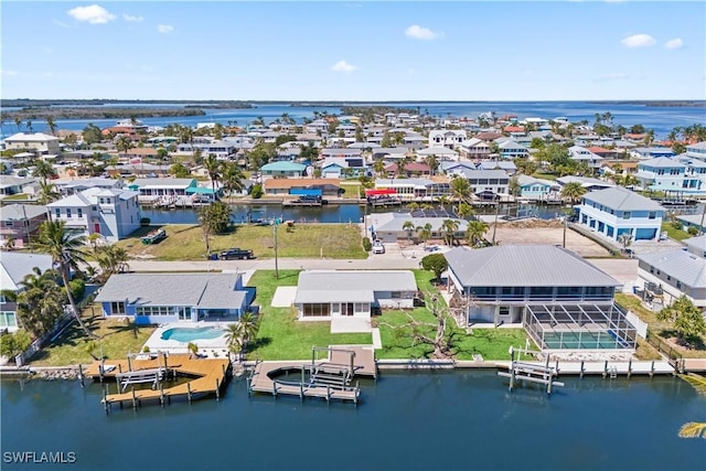 aerial view featuring a residential view and a water view