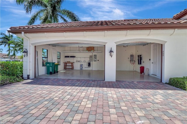 garage featuring decorative driveway