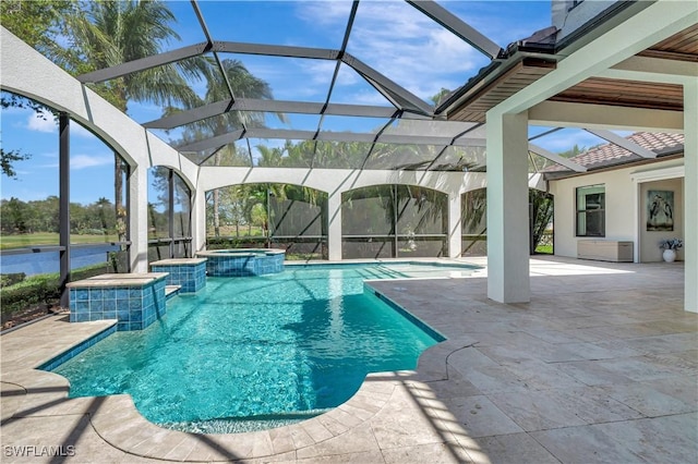 view of pool with a patio, a lanai, and a pool with connected hot tub