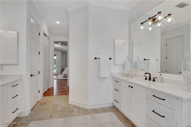 full bath with vanity, baseboards, visible vents, stone finish flooring, and crown molding