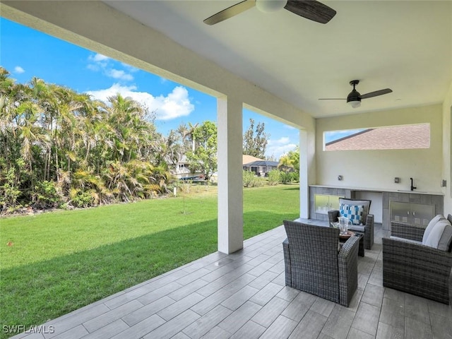 view of patio featuring outdoor lounge area and a ceiling fan