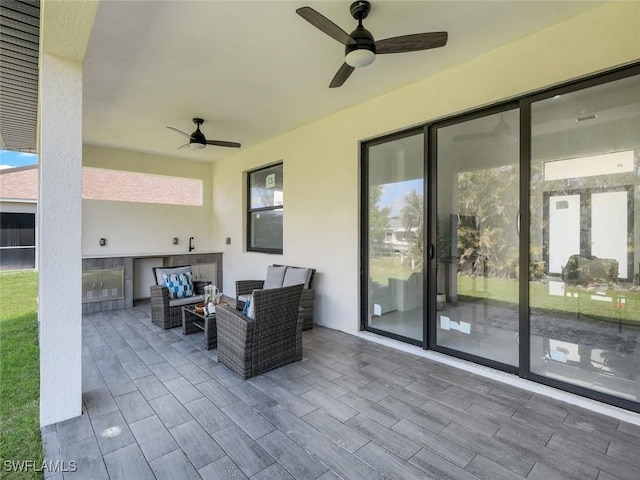 view of patio featuring a ceiling fan and an outdoor hangout area