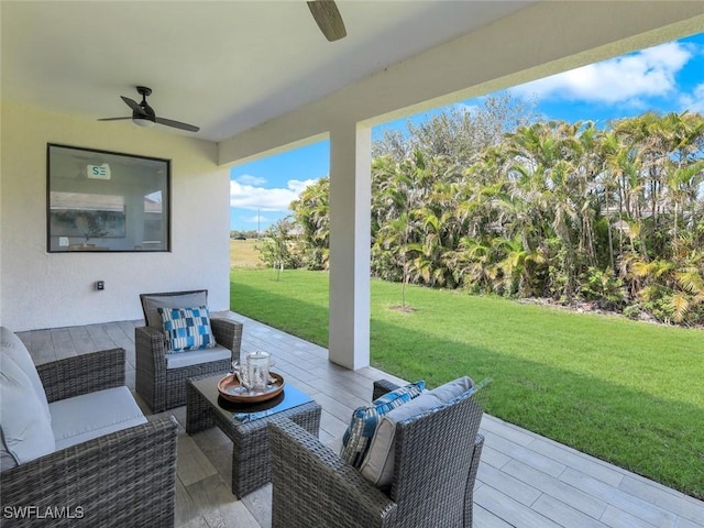 view of patio featuring an outdoor living space and a ceiling fan