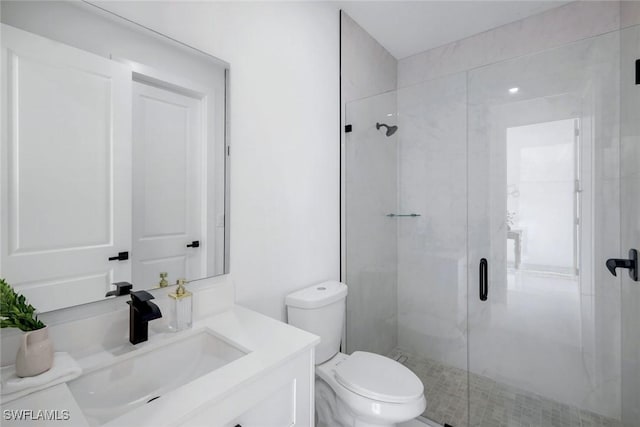 full bath featuring a shower stall, toilet, and vanity