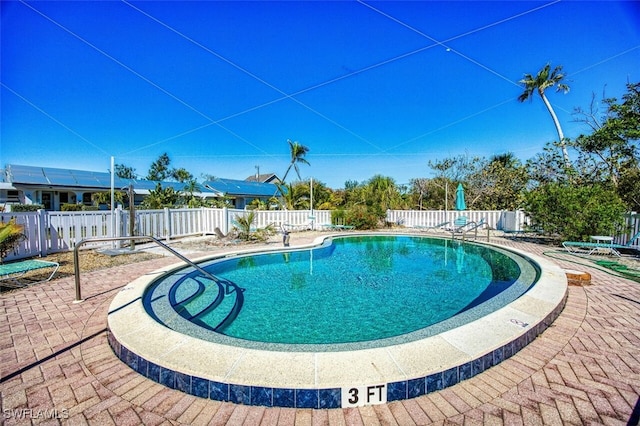 pool featuring a patio area and fence private yard