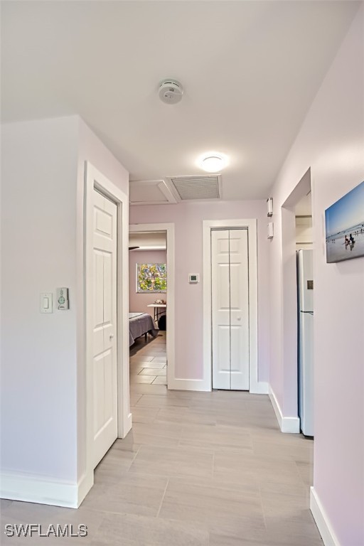 corridor with baseboards