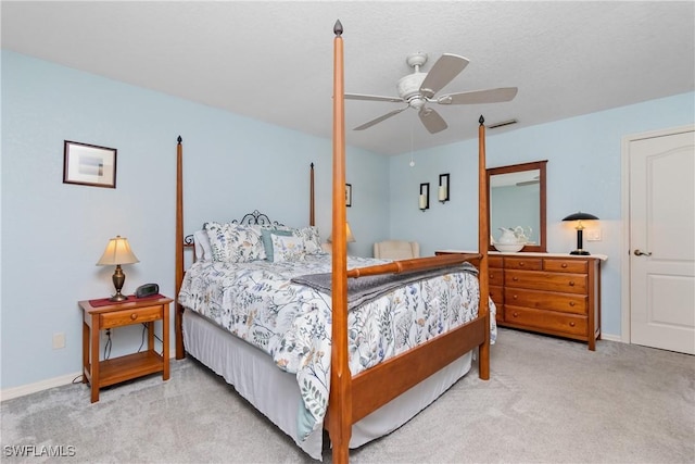 carpeted bedroom featuring a ceiling fan and baseboards