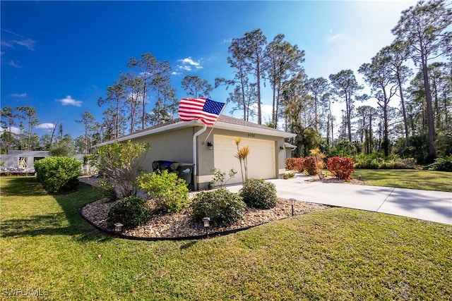 view of home's exterior with an attached garage, stucco siding, concrete driveway, and a yard