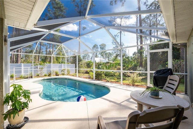 view of swimming pool featuring a fenced in pool, glass enclosure, a patio, and fence