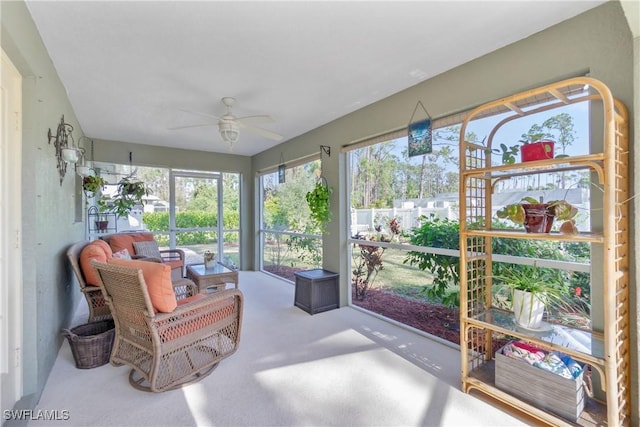 sunroom with a ceiling fan