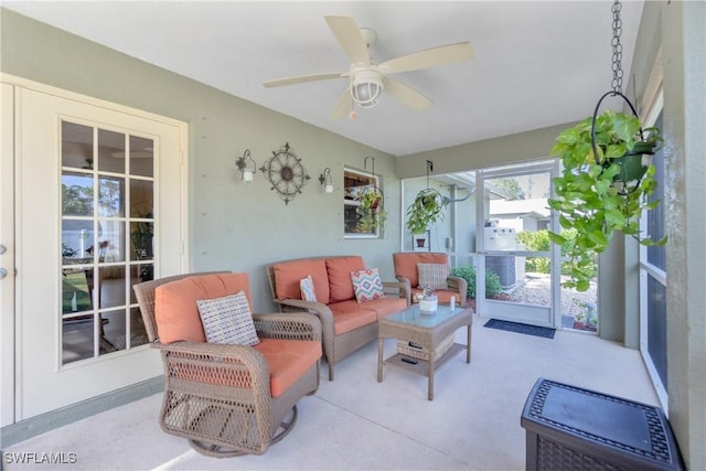 sunroom / solarium with a ceiling fan