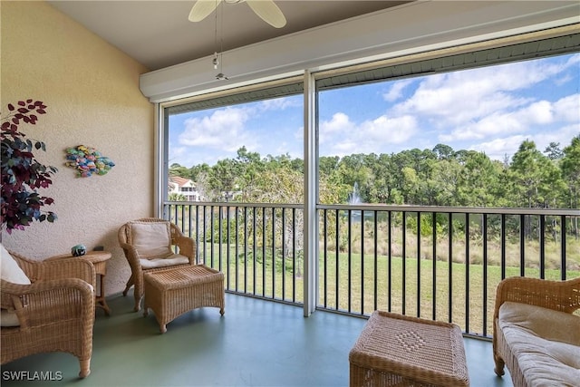 sunroom with a ceiling fan