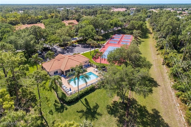 aerial view featuring a wooded view