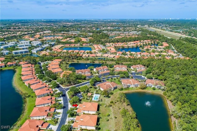 drone / aerial view with a residential view and a water view