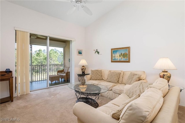 carpeted living area featuring vaulted ceiling and ceiling fan