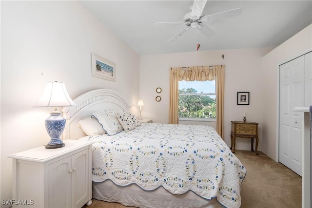 bedroom with ceiling fan and light carpet