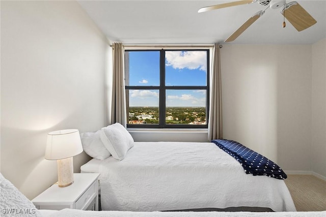 carpeted bedroom featuring a ceiling fan