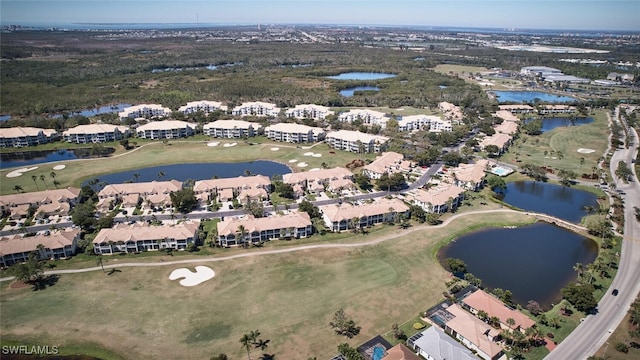 bird's eye view with view of golf course, a water view, and a residential view