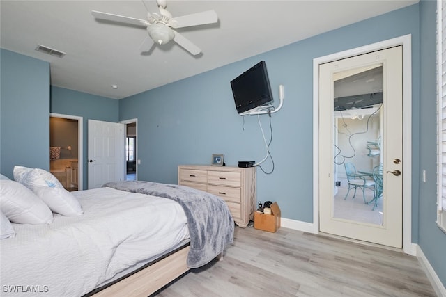 bedroom featuring visible vents, light wood-style floors, connected bathroom, ceiling fan, and baseboards