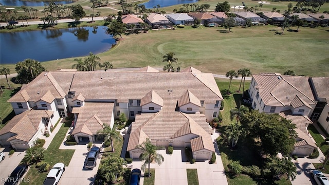 bird's eye view with a residential view and a water view