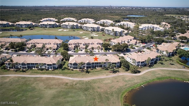 bird's eye view with view of golf course, a water view, and a residential view