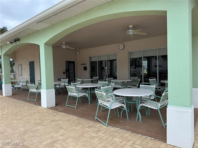 view of patio / terrace with outdoor dining area and a ceiling fan