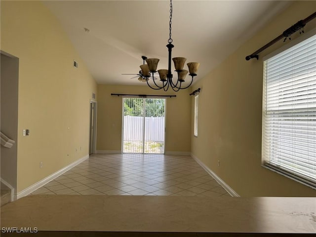 unfurnished room with light tile patterned floors, lofted ceiling, visible vents, baseboards, and an inviting chandelier